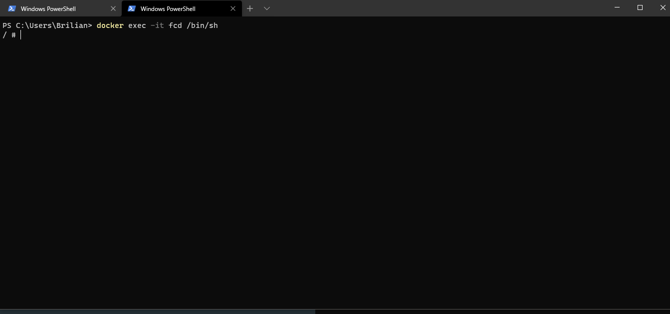 Opening a shell in the running BusyBox container with docker exec.